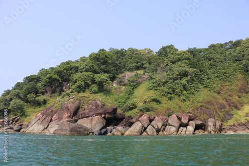 rocky green island of butterflies in South Goa, India
