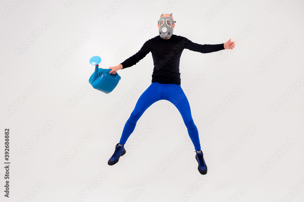 Funny strange man in respirator jumping over white background