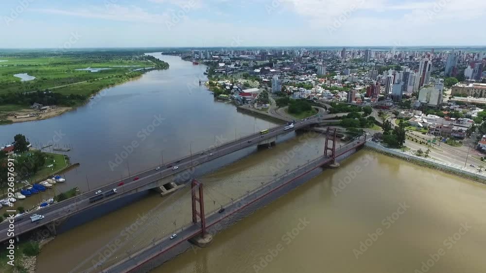 Static Aerial View of Traffic on Bridges Above Santa Fe River, Argentina, Waterfront and Cityscape on Sunny Summer Day, Drone Shot Static Aerial View of Traffic on Bridges Above Santa Fe River, Argentina, Waterfront and Cityscape on Sunny Summer Day, Drone Shot