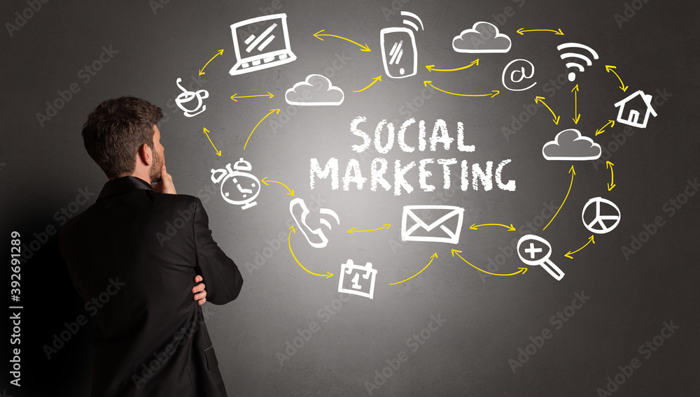 businessman drawing social media icons with SOCIAL MARKETING inscription, new media concept businessman drawing social media icons with SOCIAL MARKETING inscription, new media concept