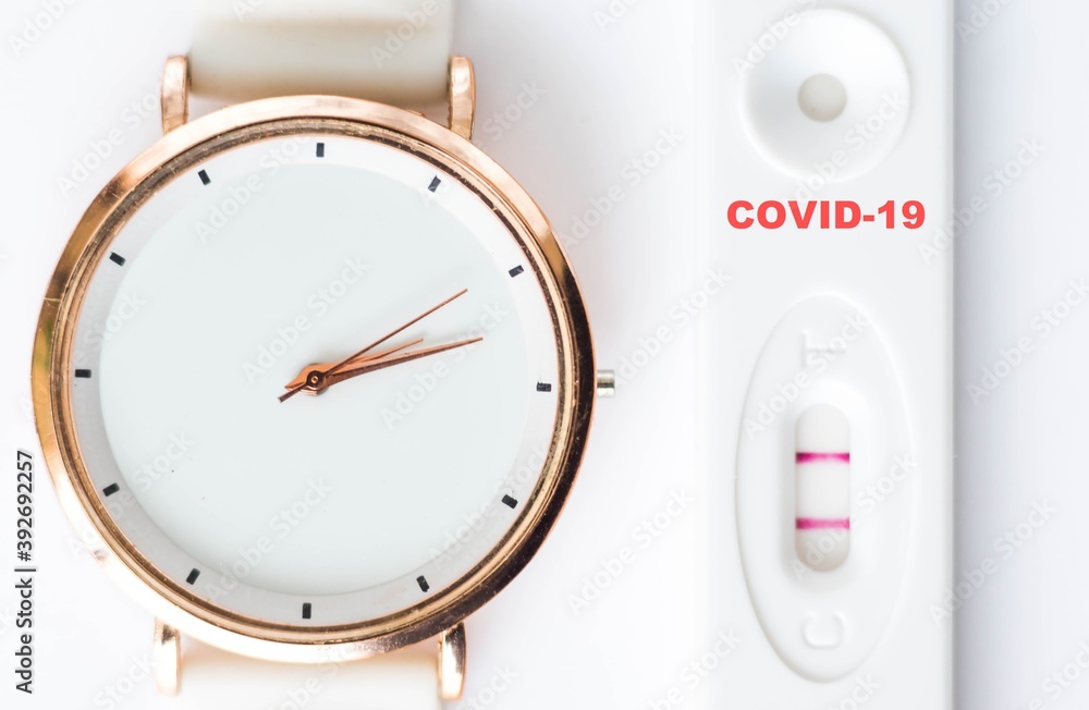 Positive result of coronavirus, covid-19 test with white clock on white background. Corona testing, epidemic control concept.