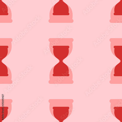 Seamless pattern of large isolated red hourglass symbols. The elements are evenly spaced. Vector illustration on light red background