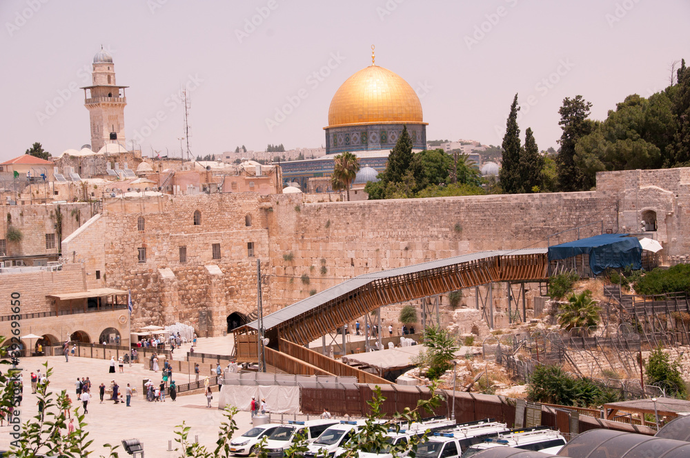 JERUSALEM ISRAEL: At the Western Wall, an ancient limestone wall in the Old City of Jerusalem. The golden dome in the distance architecture,