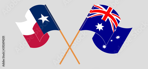 Crossed and waving flags of the State of Texas and Australia