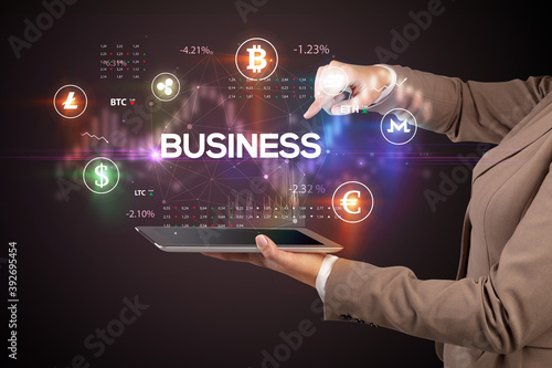 Close-up of a touchscreen with BUSINESS inscription, business opportunity concept