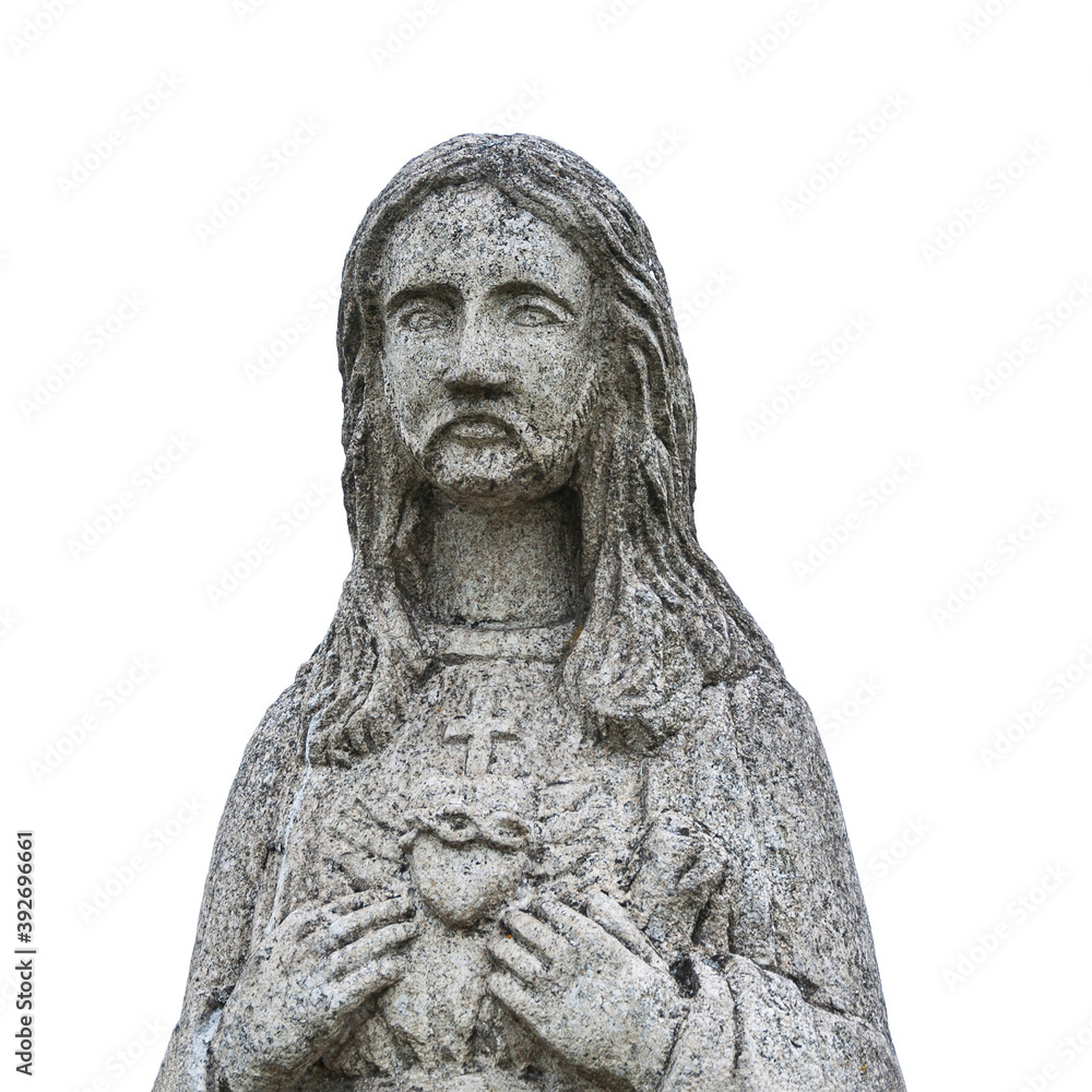 Ancient statue of Jesus Christ. He points a finger at his heart. White background (religion, faith concept) Ancient statue of Jesus Christ. He points a finger at his heart. White background (religion, faith concept)