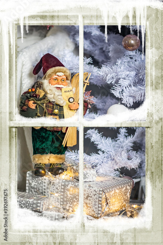 Santa Claus through a frozen window