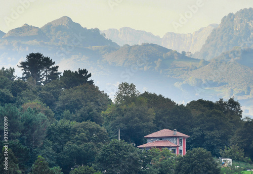 Sunrise amid mist in the towns of Picos de Europa photo