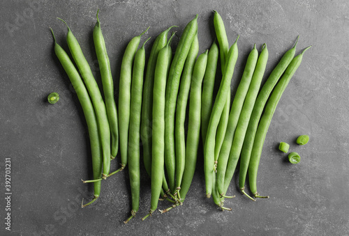 Fresh green beans on grey table, flat lay