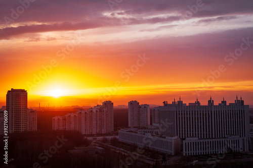 horizontal panoramic sunset over the city industrial architecture buildings sun explosion © Aliaksandr