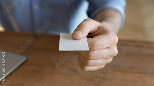 Fotografie Businessman give business card with personal info to client or partner, close up