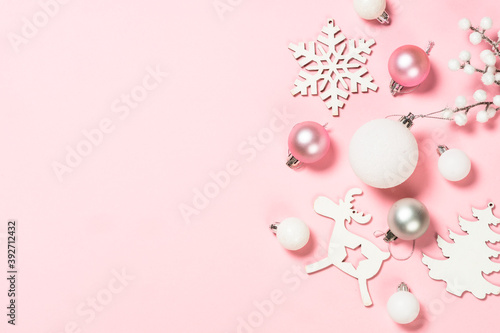 Christmas pink flat lay background with holiday decorations.