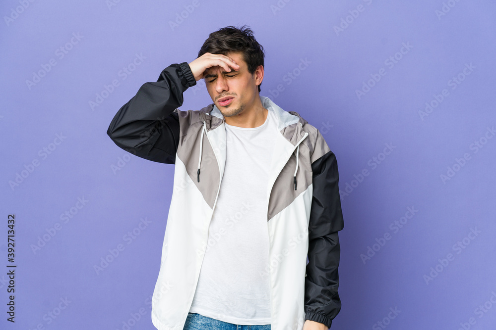 Young cool man touching temples and having headache. Young cool man touching temples and having headache.