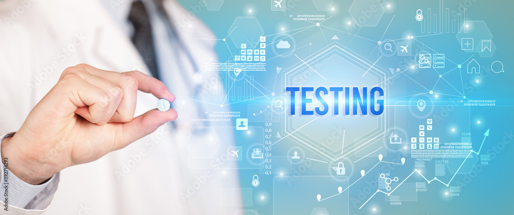 Doctor giving a pill with TESTING inscription, new technology solution concept Doctor giving a pill with TESTING inscription, new technology solution concept