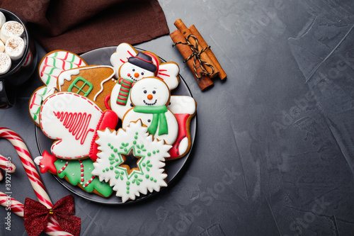 Delicious Christmas cookies on black table, flat lay. Space for text photo