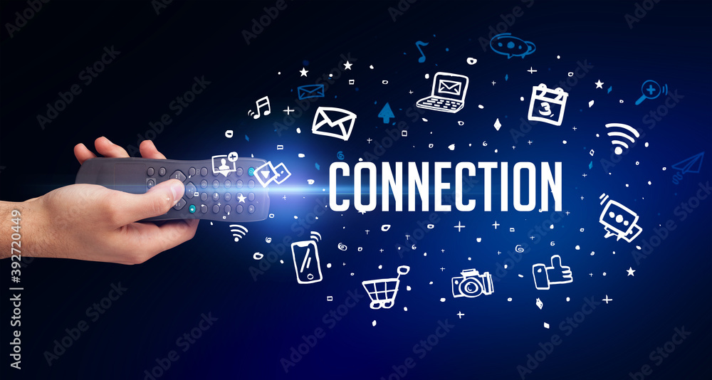hand holding wireless peripheral with CONNECTION inscription, social media concept hand holding wireless peripheral with CONNECTION inscription, social media concept