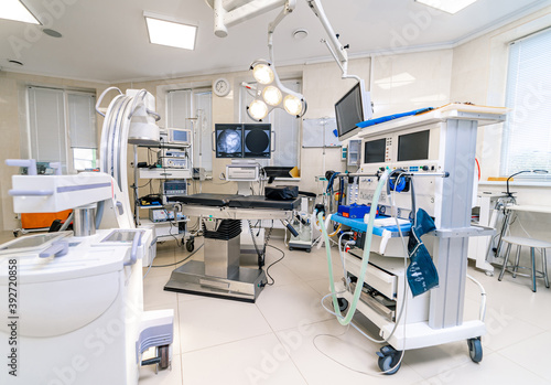 Hospital interior with operating surgery table, lamps and ultra modern devices, technology in modern clinic