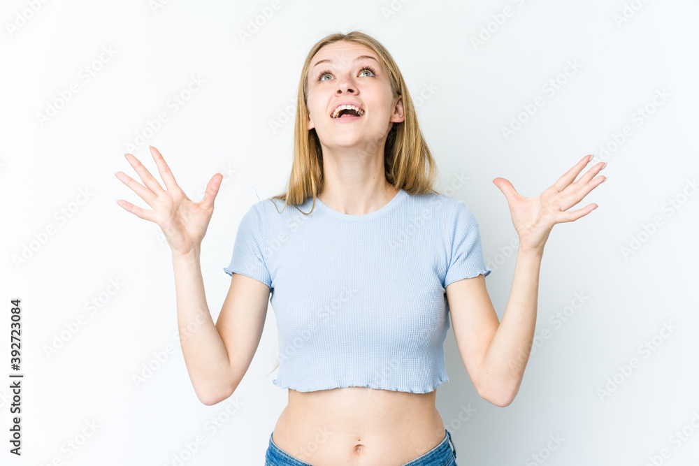 Young blonde woman isolated on white background screaming to the sky, looking up, frustrated. Young blonde woman isolated on white background screaming to the sky, looking up, frustrated.