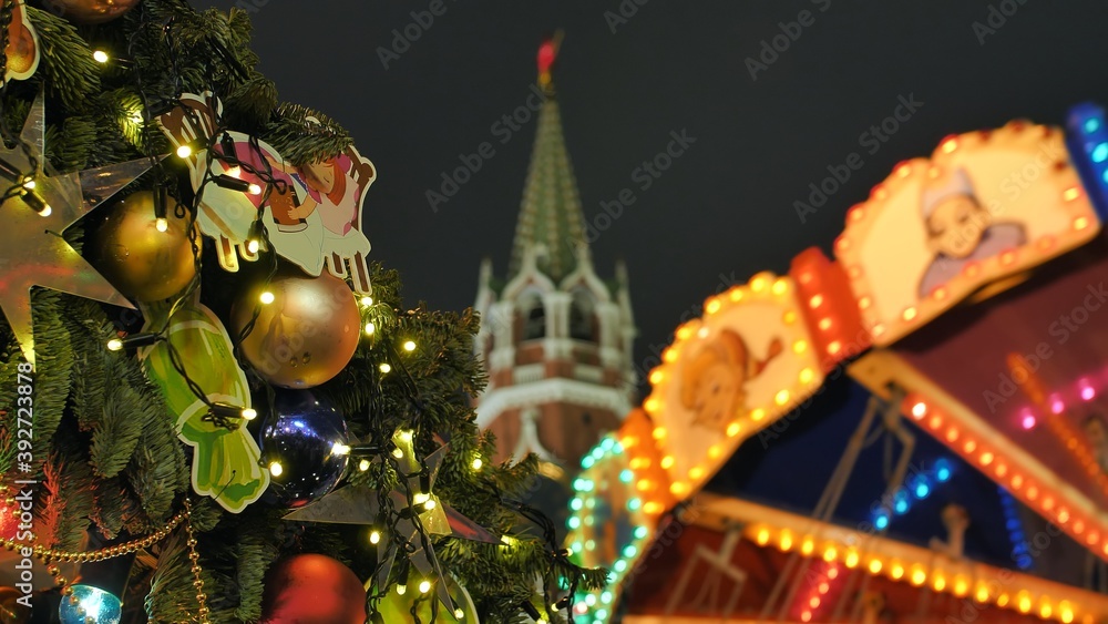 Fototapeta premium Russian carousel against the background of the Red Square against the background of the Kremlin.