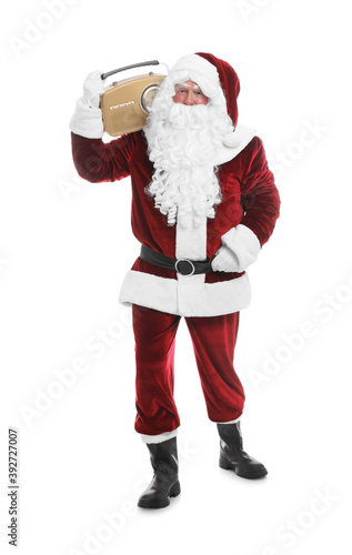 Santa Claus with vintage radio on white background. Christmas music