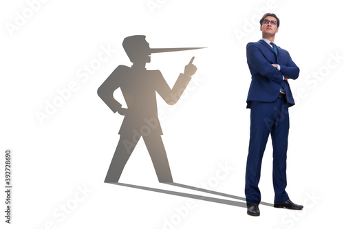 Concept of businessman liar with his shadow photo