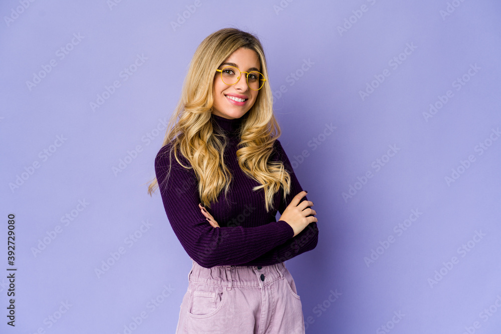 Fototapeta premium Young caucasian blonde woman who feels confident, crossing arms with determination.