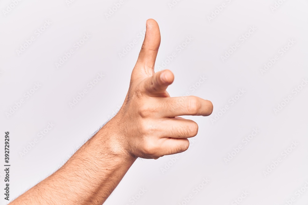 Close up of hand of young caucasian man over isolated background pointing forefinger to the camera, choosing and indicating towards direction