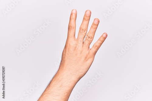 Close up of hand of young caucasian man over isolated background counting number 4 showing four fingers