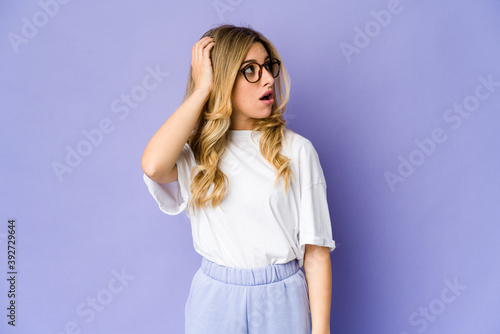 Young caucasian blonde woman being shocked, she has remembered important meeting.