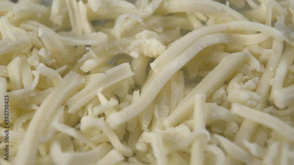 Fresh grated cheese close-up. Macro shot. Rotation Fresh grated cheese close-up. Macro shot. Rotation
