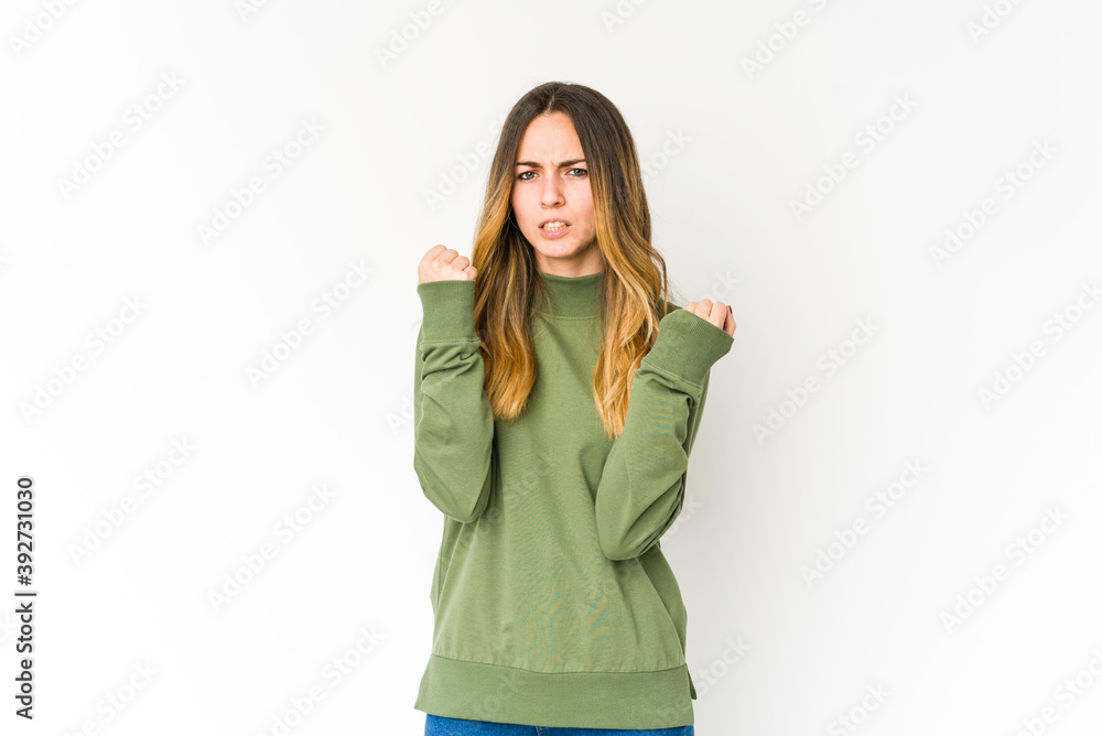 Young caucasian woman isolated on white background upset screaming with tense hands. Young caucasian woman isolated on white background upset screaming with tense hands.