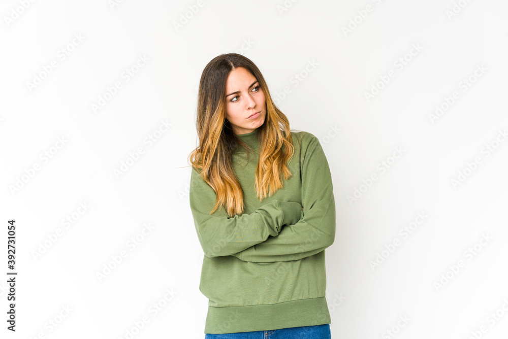 Young caucasian woman isolated on white background tired of a repetitive task. Young caucasian woman isolated on white background tired of a repetitive task.