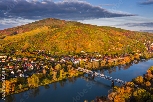 фотографія Tokaj, Hungary - Aerial panoramic view of the small town of Tokaj with golden vineyards on the hills of wine region on a warm sunny autumn morning