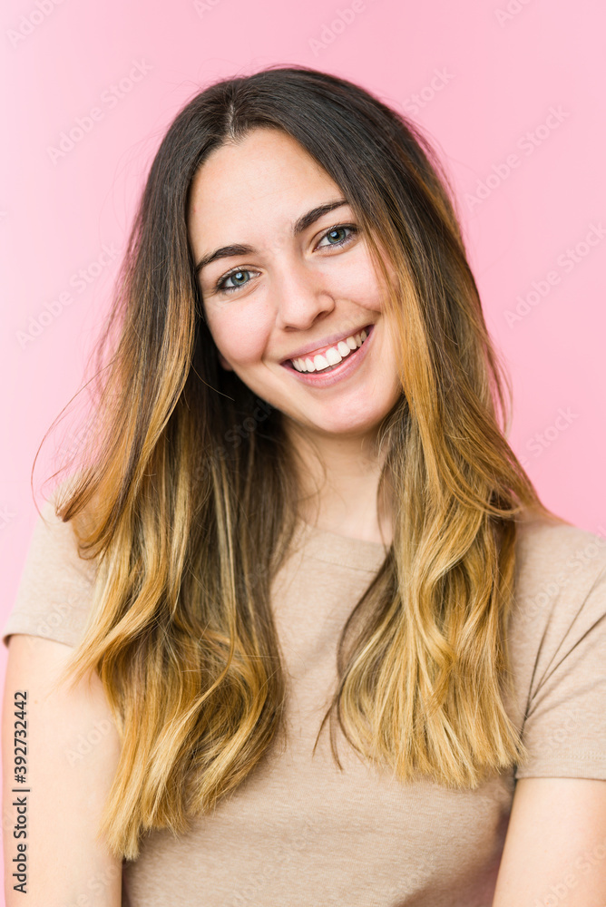 Young beautiful woman isolated on pink background Young beautiful woman isolated on pink background