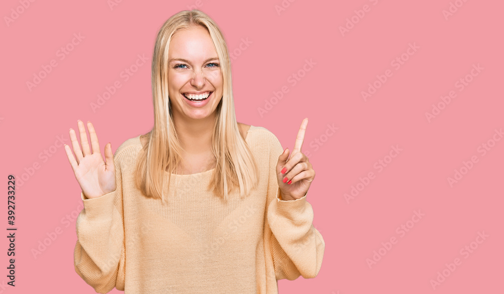 Young blonde girl wearing casual clothes showing and pointing up with fingers number six while smiling confident and happy. Young blonde girl wearing casual clothes showing and pointing up with fingers number six while smiling confident and happy.