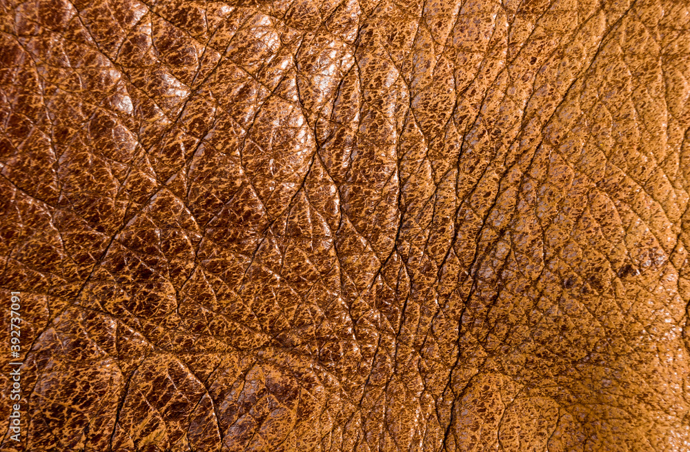 Obraz premium Old vintage genuine soft brown leather texture background, top layer with pores and scratches, macro, close-up