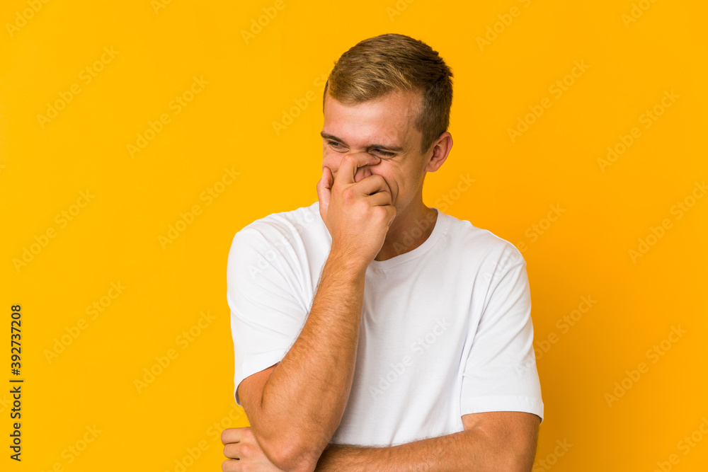 Young caucasian handsome man laughing happy, carefree, natural emotion. Young caucasian handsome man laughing happy, carefree, natural emotion.