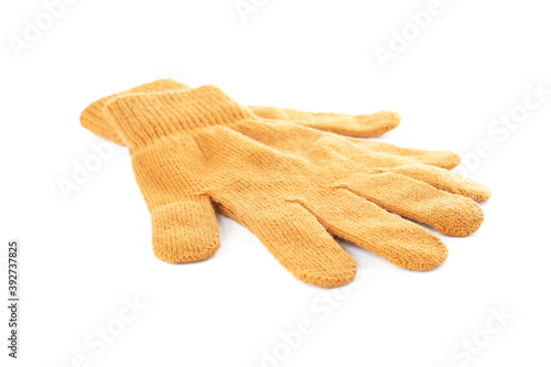 Yellow woolen gloves on white background. Winter clothes