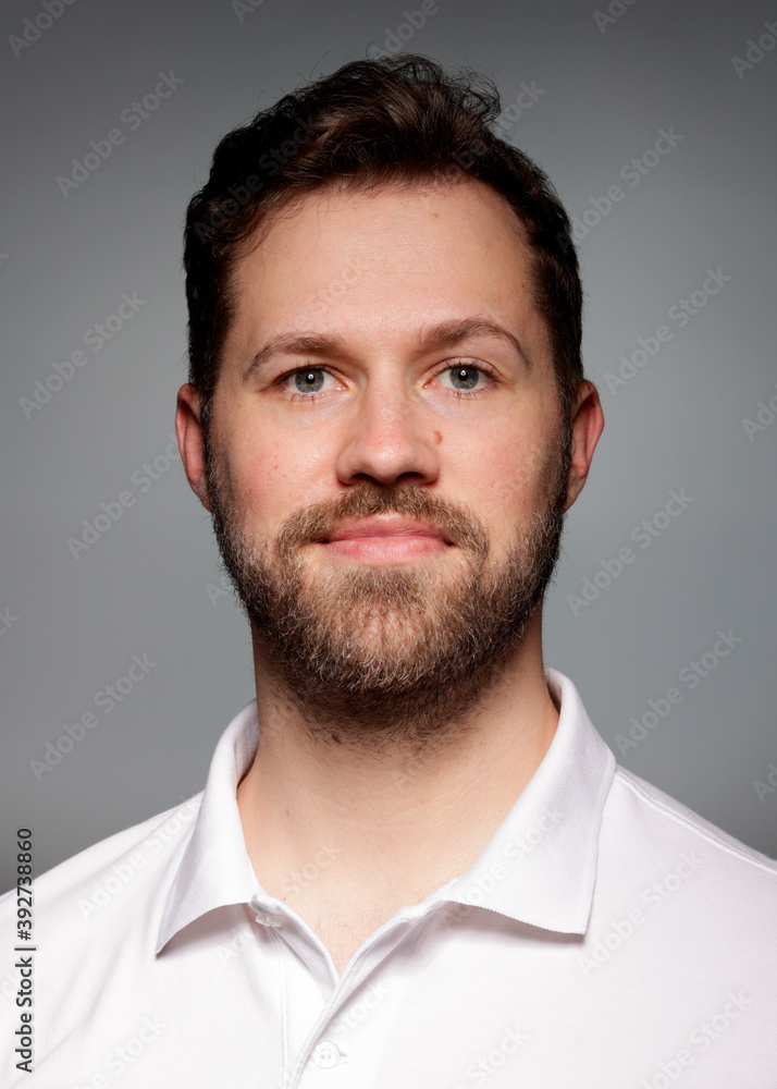 Fototapeta premium Application photo of young white male with beard on grey Background