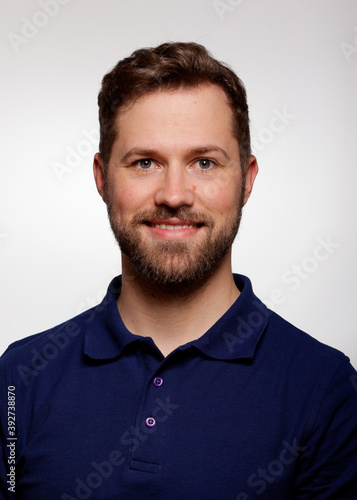 Application photo of young white male blue shirt with beard on white Background