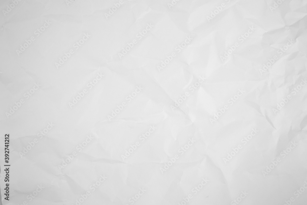 white and gray crumpled paper texture background. crush paper so that it becomes creased and wrinkled. white and gray crumpled paper texture background. crush paper so that it becomes creased and wrinkled.