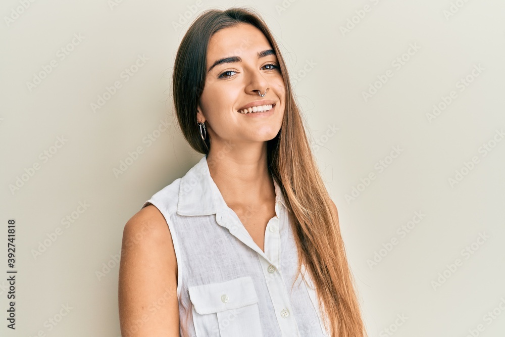 Young hispanic girl smiling happy standing over isolated white background. Young hispanic girl smiling happy standing over isolated white background.