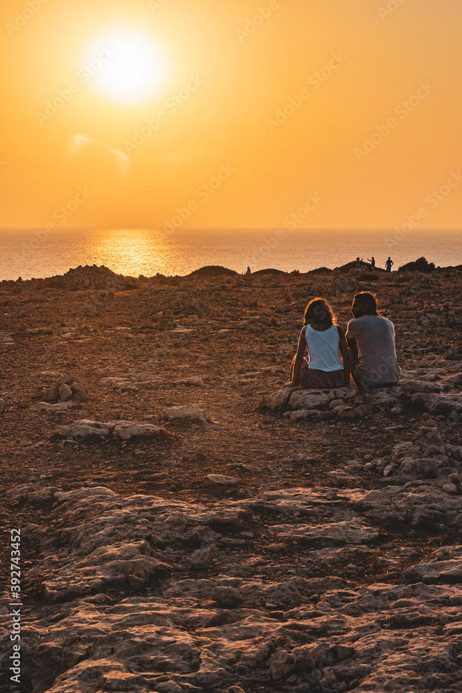 Couple enjoying the sunset at Formentera