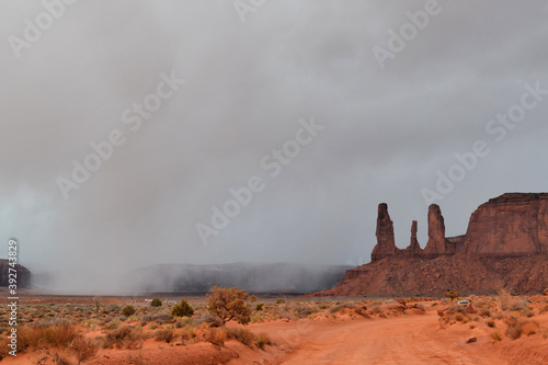Obraz na płótnie Three Sisters rocks before the storm, Monument Valley, Utah w salonie