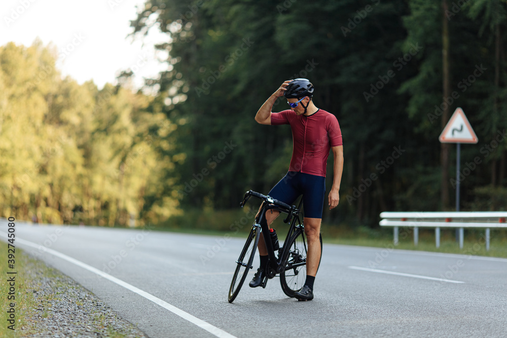 Healthy and fit cyclist resting after ride on fresh air