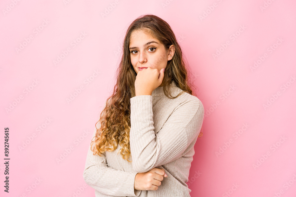 Young caucasian woman suspicious, uncertain, examining you. Young caucasian woman suspicious, uncertain, examining you.