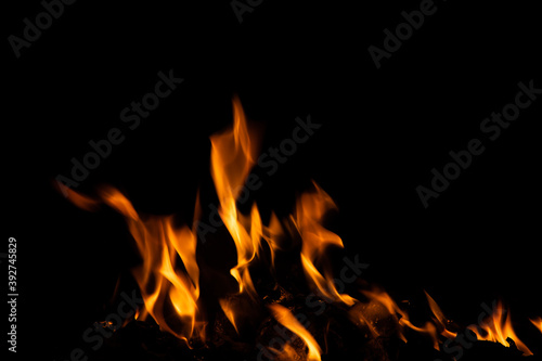 Fire flames on black background. fire burst texture for banner backdrop. © ooddysmile
