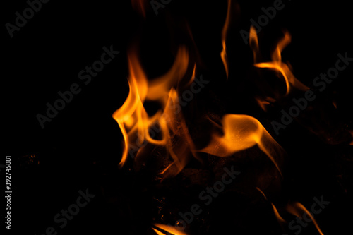 Fire flames on black background. fire burst texture for banner backdrop.