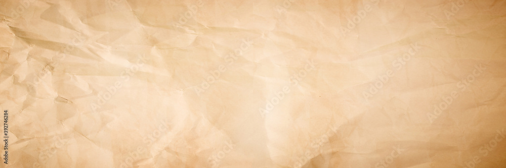 brown crumpled paper texture background. crush paper so that it becomes creased and wrinkled.