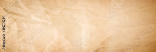 brown crumpled paper texture background. crush paper so that it becomes creased and wrinkled.